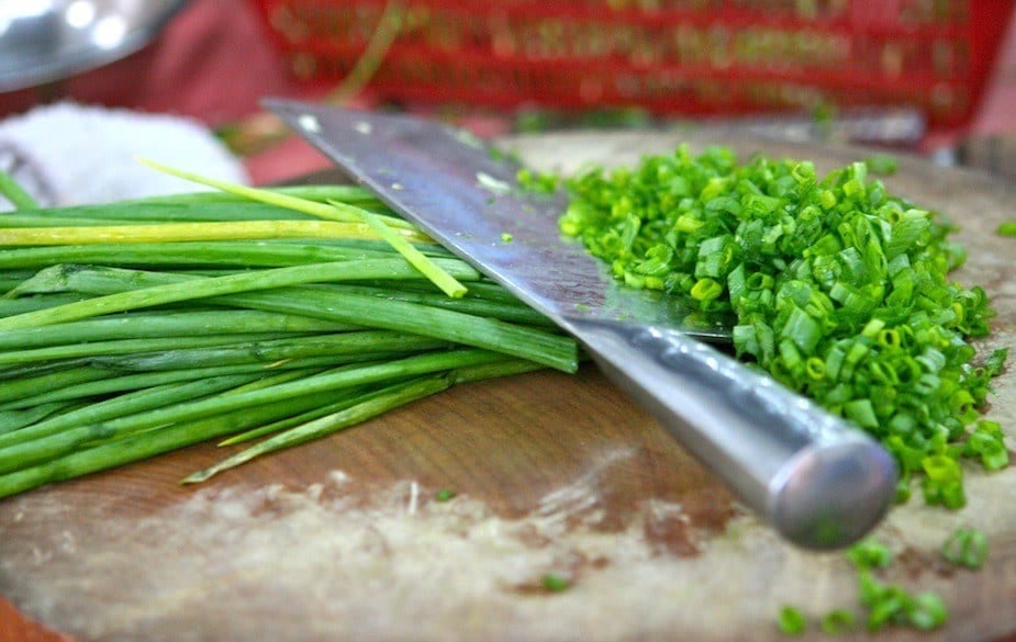 Preparing scallions. Preparing scallions.