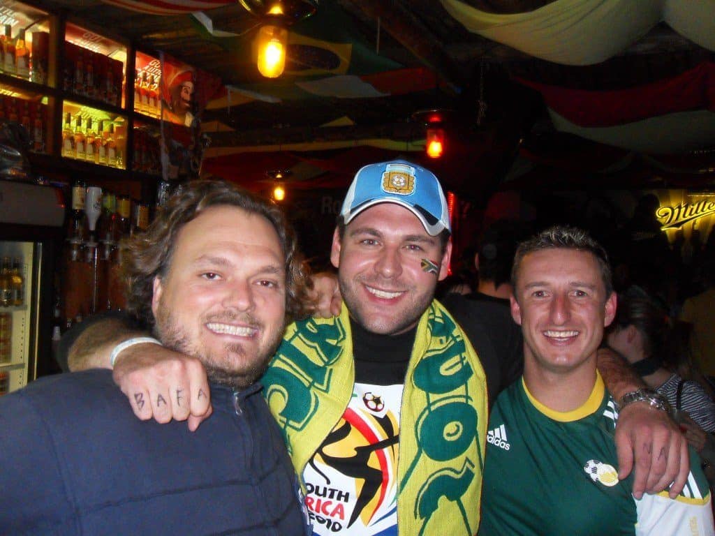 The author (left) meeting friends at a pub.