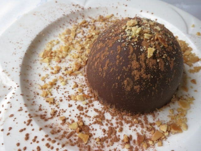Chocolate dessert For dessert it was chocolate goodness. It looked like somebody threw this little guy at the plate. Look at the nuts and cocoa powder left from the impact.