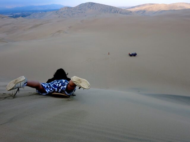 Sandboarding in Huacachina is all about picking up speed. 