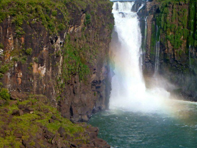 Iguazú Falls A rainbow forms in front of one of the falls.