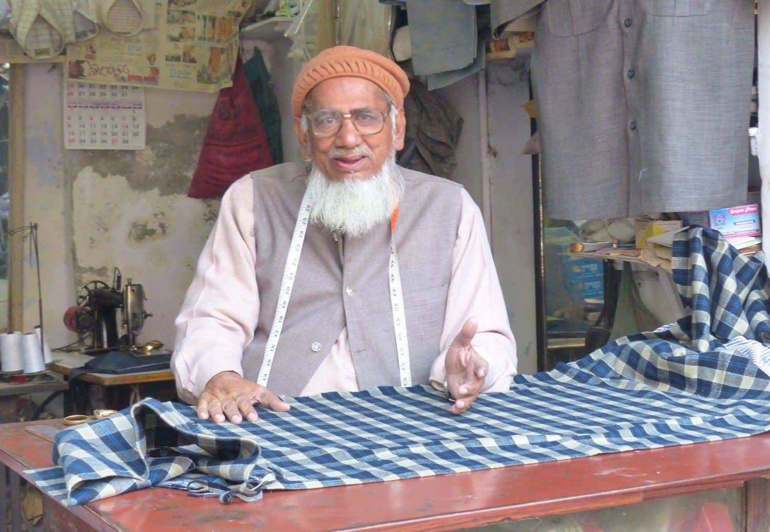An Indian tailor, hard at work.