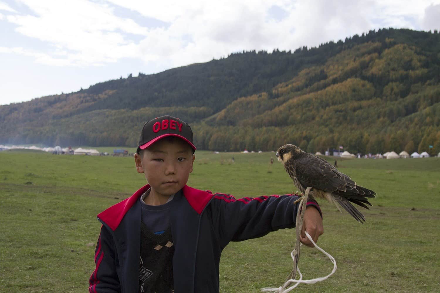 A young Kyrgyz boy who very kindly let me snap a pic of him and his falcon.