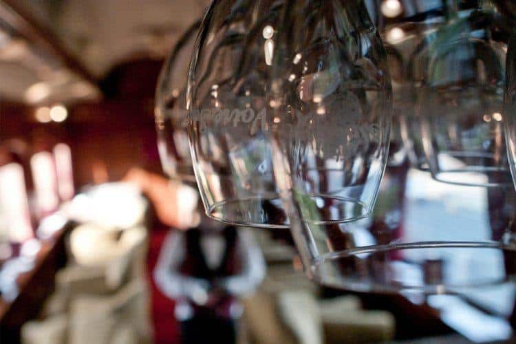 Wine glasses on a first class train carriage - fill 'em up, please. (Credit: Michele Ursino)