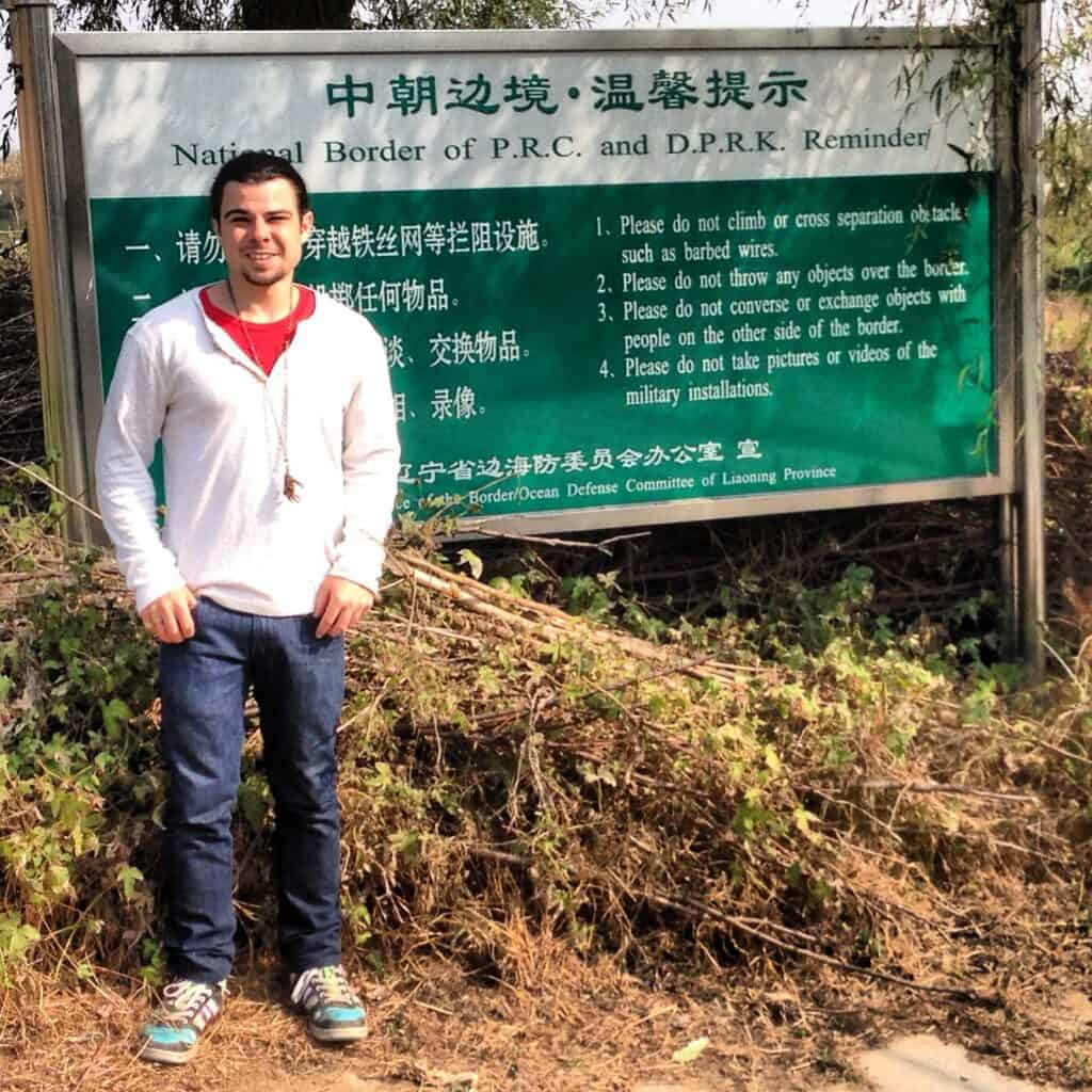 Standing by sign DPRK-China border