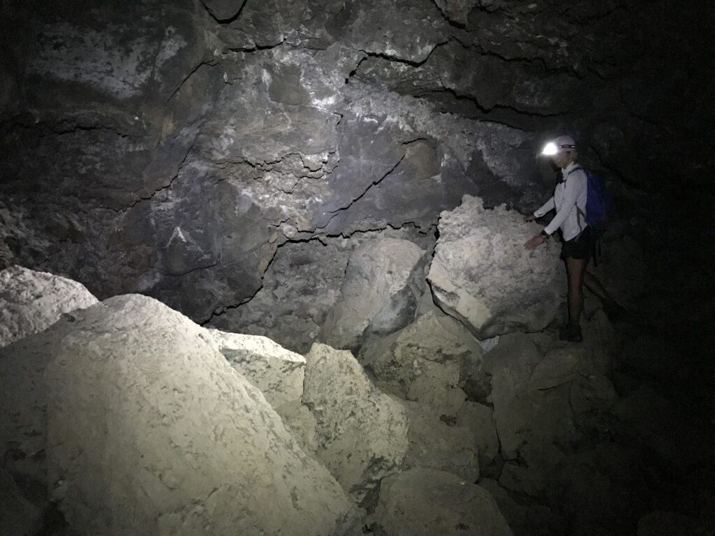 Exploring underground lava tubes during a road trip to Zion National Park.
