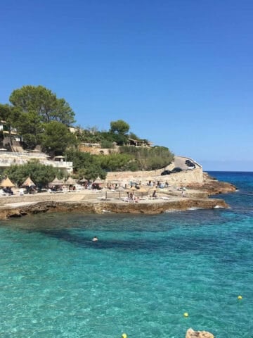 Turquoise waters in Cala Sant Vicenc in Mallorca, Spain (photo: James Honeyball).