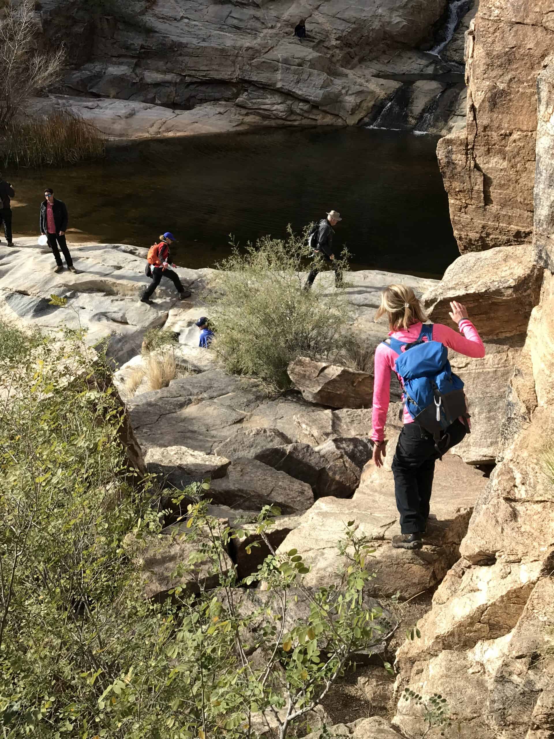 Climbing down to one of the Seven Pools in Bear Canyon