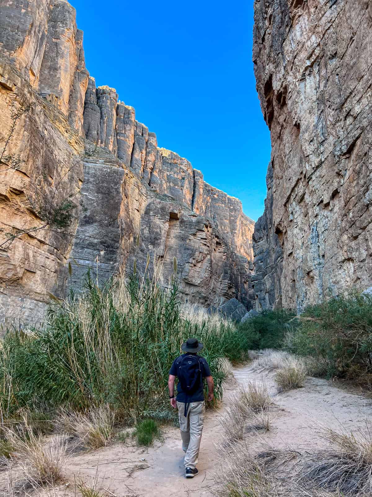 Dave hiking amid 1,500-foot walls (photo: Kelly Lemons)