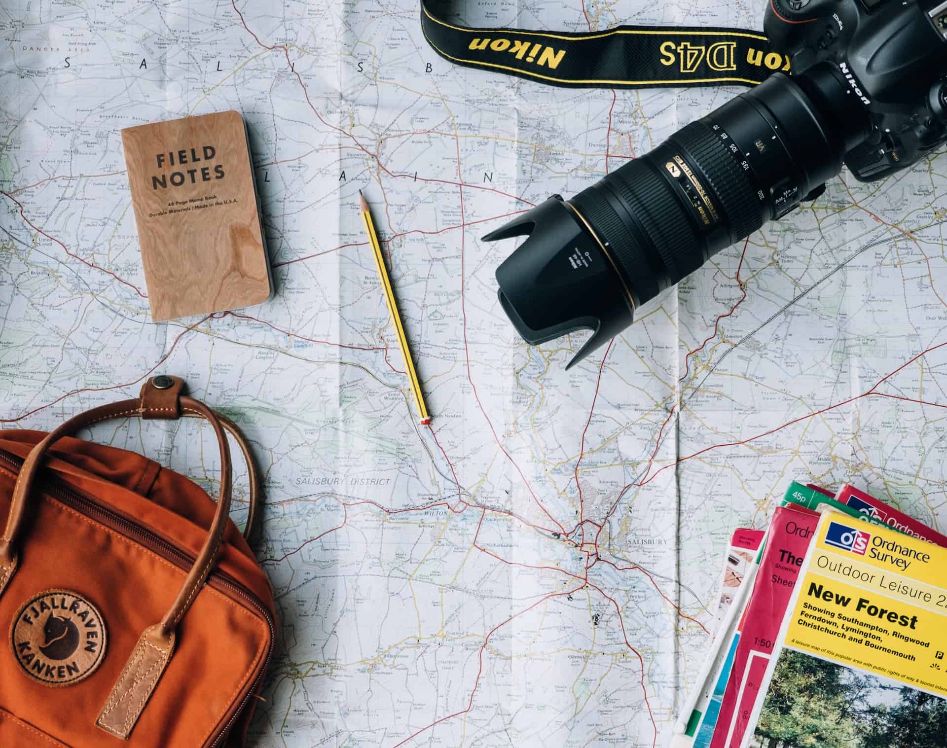 Maps and a camera serve as travel inspiration (photo: Annie Spratt).