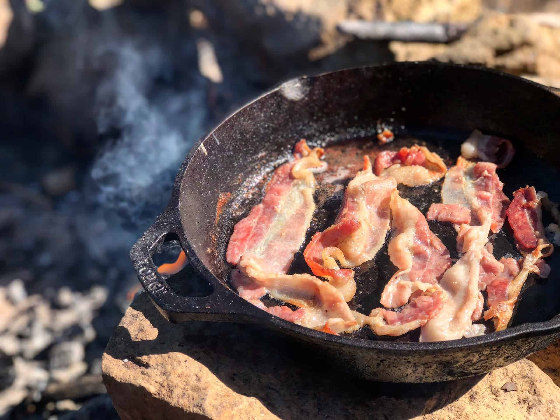 Bacon sizzling in a cast iron skillet (photo: Casey DeViese).
