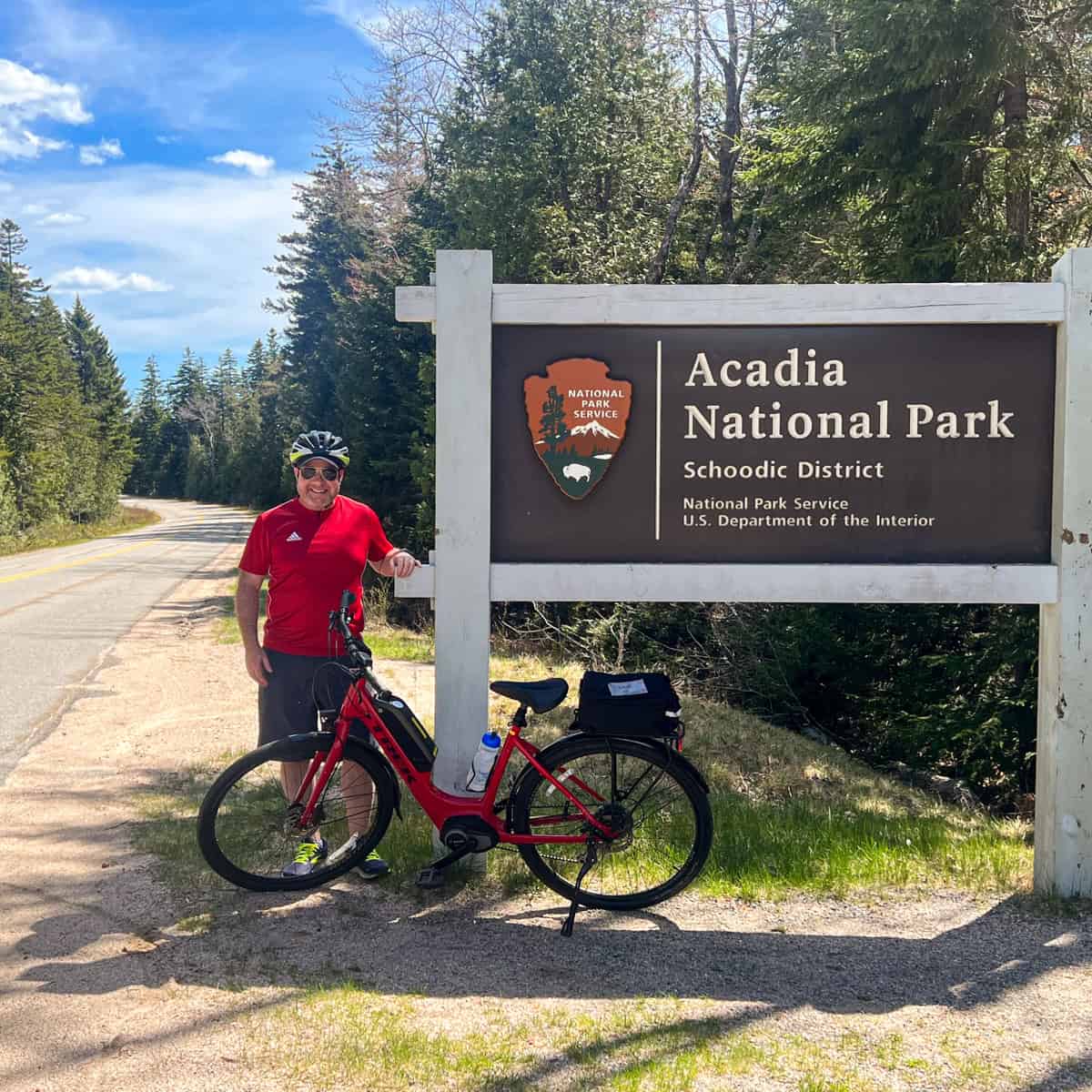 Dave with e-bike at entrance to the Schoodic Peninsula in Acadia National Park