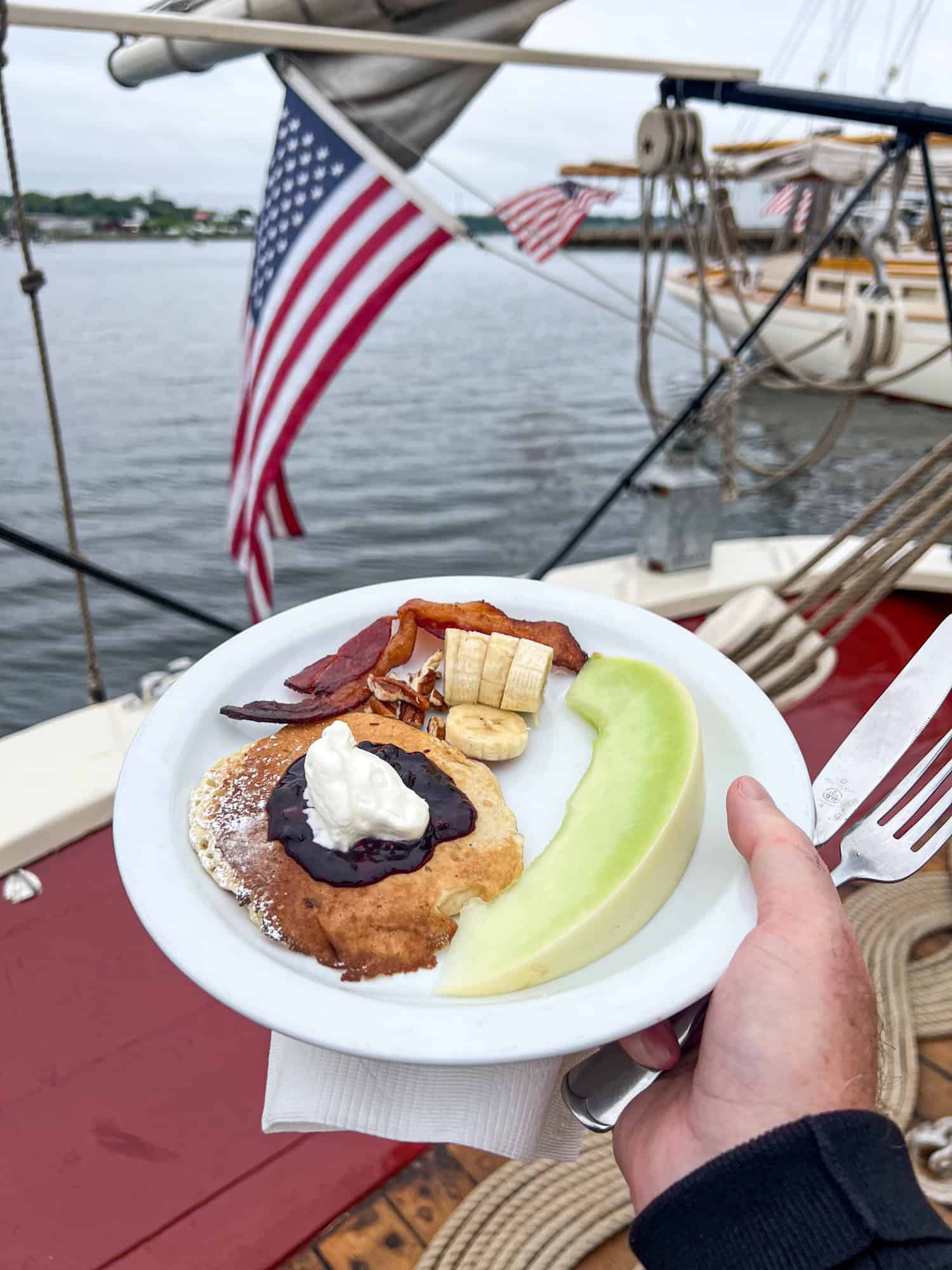 Buttermilk pancakes, bacon, and fruit aboard J & E Riggin