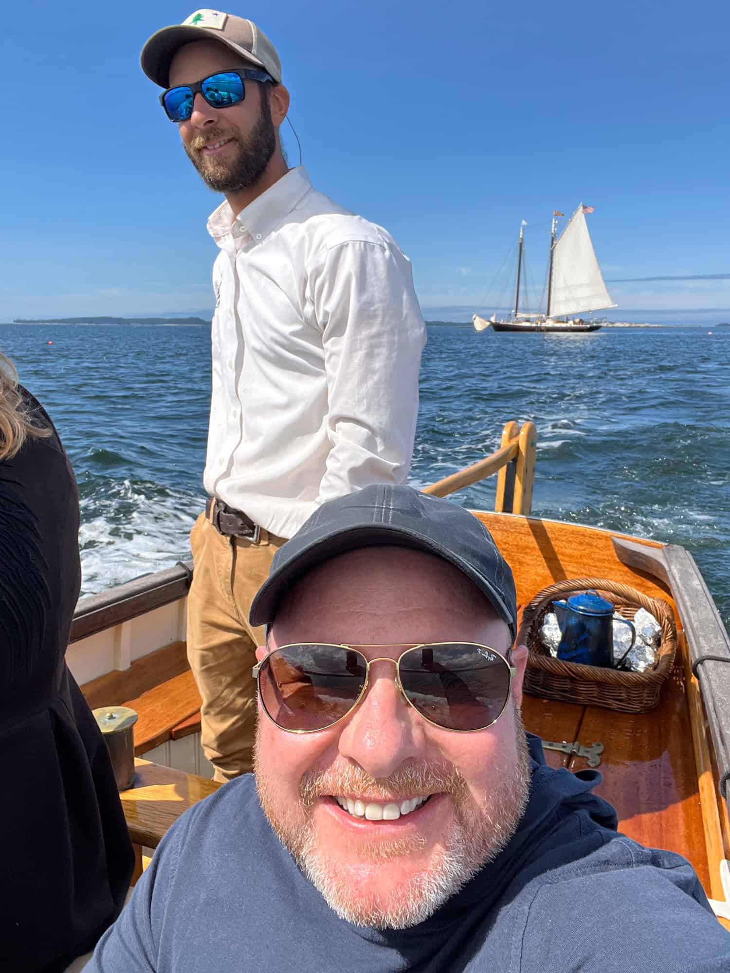 Dave on Schooner J & E Riggin's yawl boat heading to shore. Cruising on a windjammer in Maine was one of my favorite travel experiences of 2023.