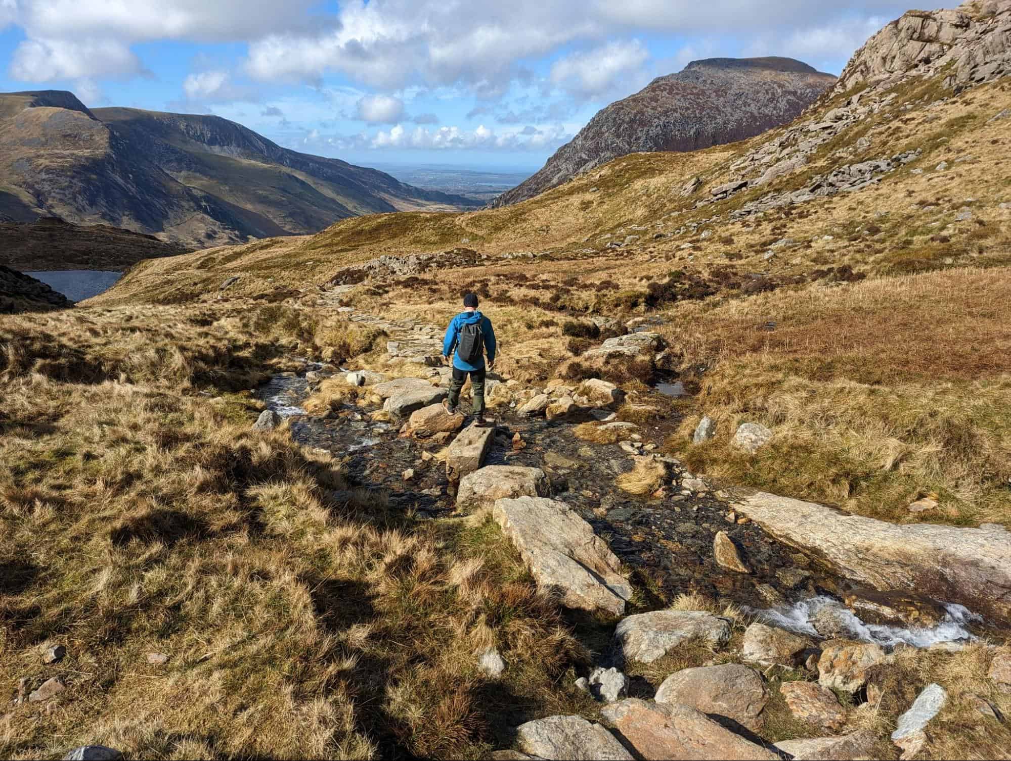 Crossing a stream on the way down from Tryfan's mountain peak in Snowdonia. (photo: Steve Cleverdon)