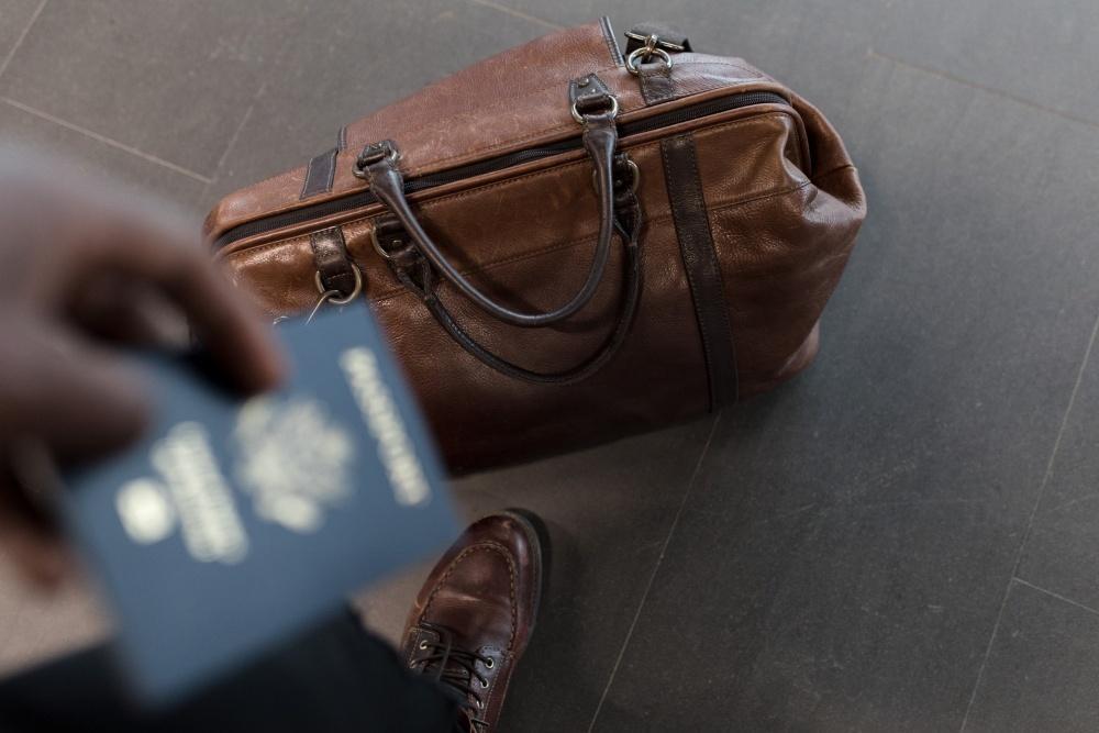 Traveler with leather bag