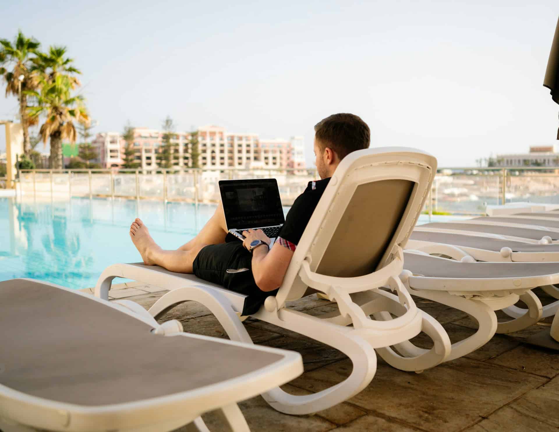 Working by a hotel pool on an international business trip (photo: Humphrey Muleba)