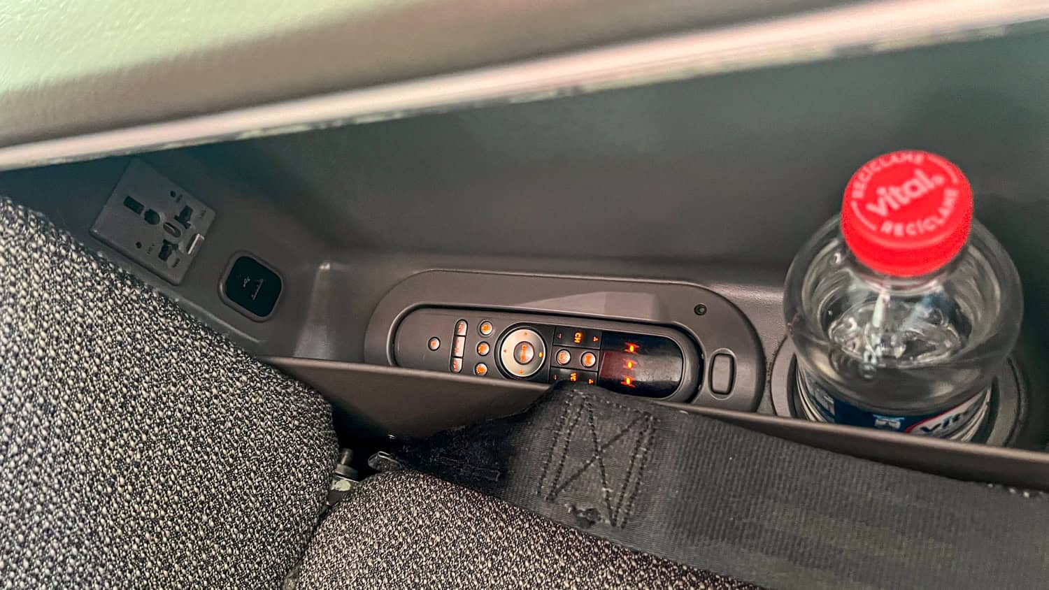 Universal 110-volt power outlet, USB outlet, TV remote, and complimentary bottled water.