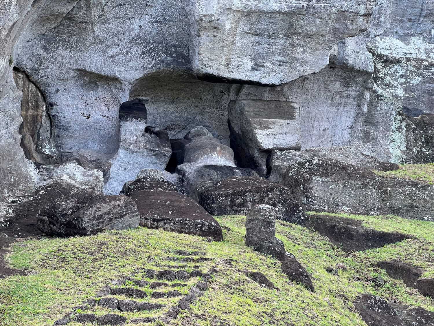 A closer look at unfinished moai carvings in the volcanic rock.
