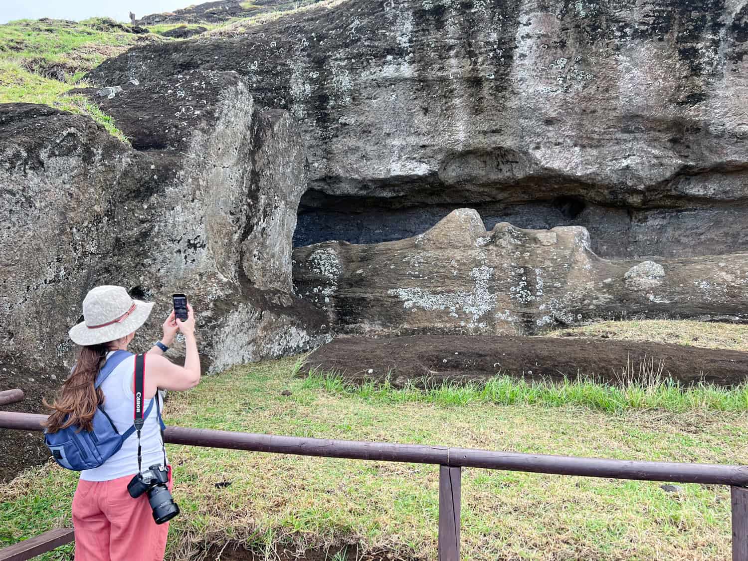Kel photographs an unfinished moai statue.