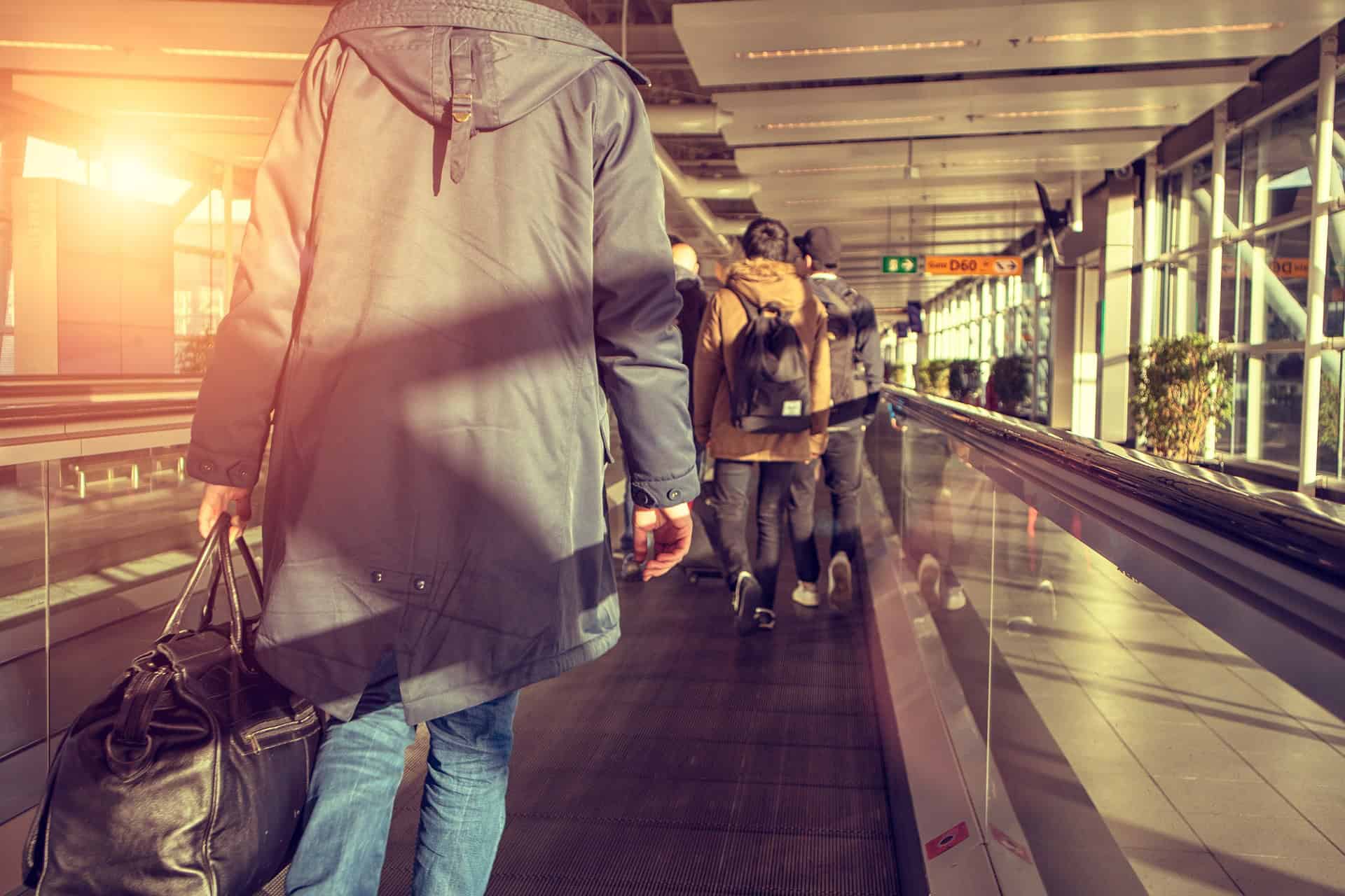 People walking through an airport (photo: Sammy-Sander).