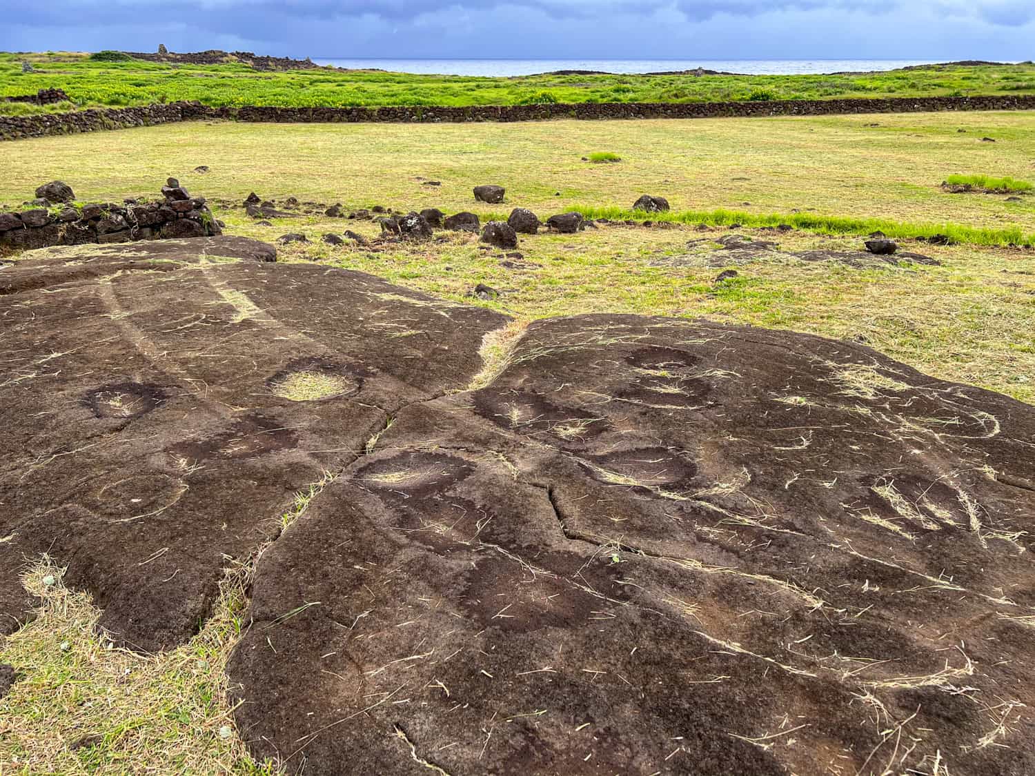 The two horizontal lines depict the hull of a canoe at Papa Vaka, a petroglyph site you can visit with a rental car on Easter Island.