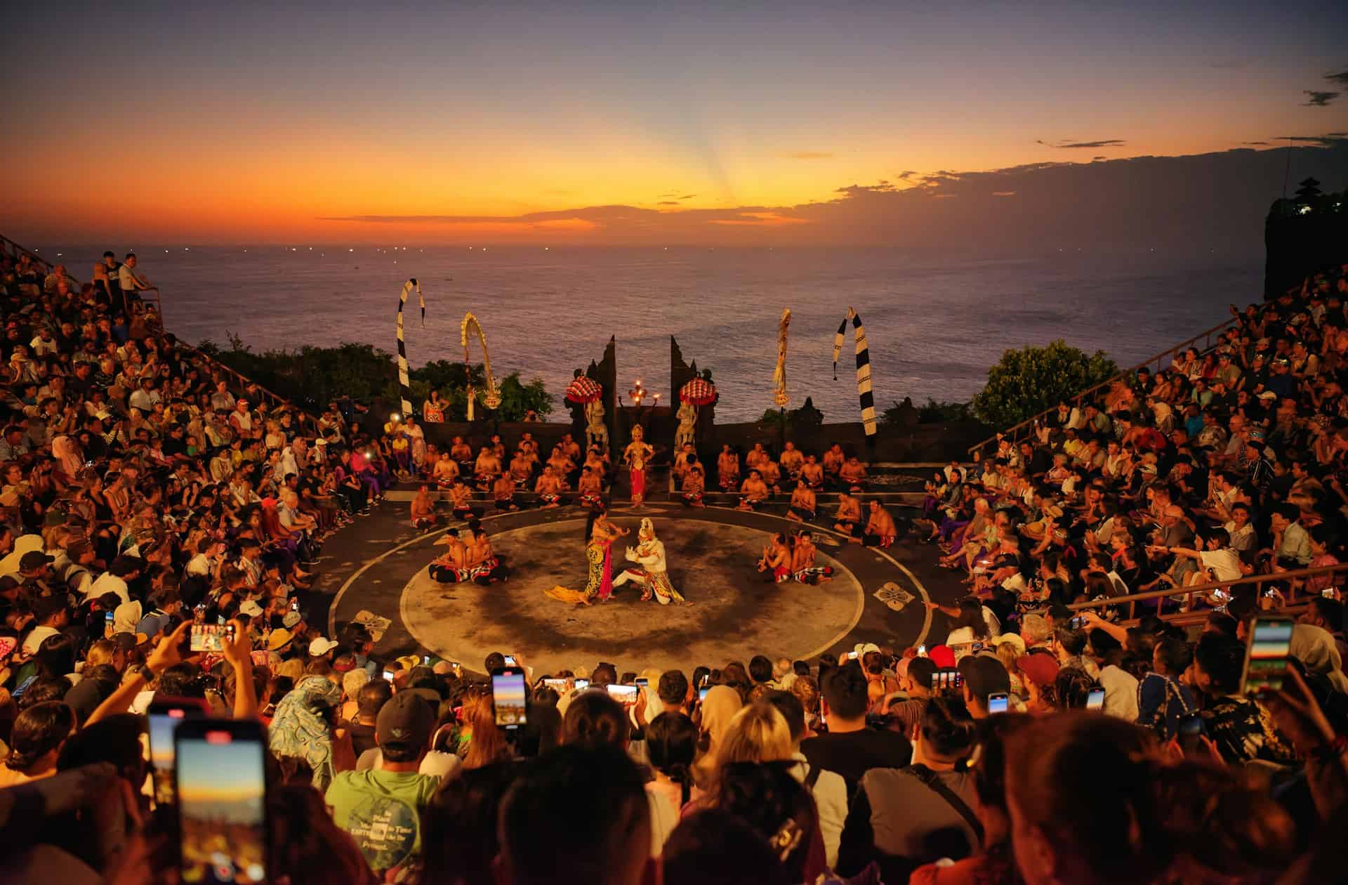 Tourists photographing a traditional Kecak dance with their phones at Uluwatu on Bali (photo: Takashi Miyazaki).