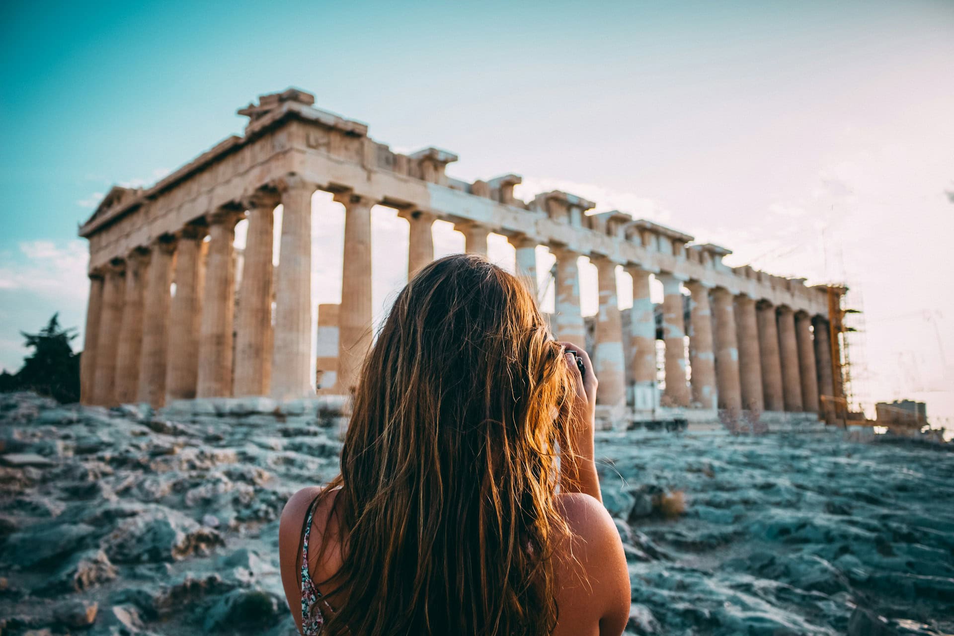 A woman photographing the Parthenon at the Acropolis in Athens (photo: Arthur Yeti).
