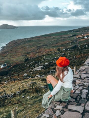 A woman looking out over the Irish coast (photo by Dannii Coughlan).