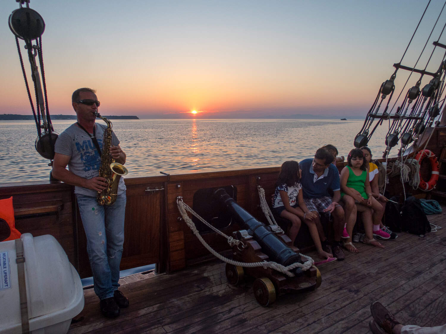 A sax player on our Santorini sunset cruise.