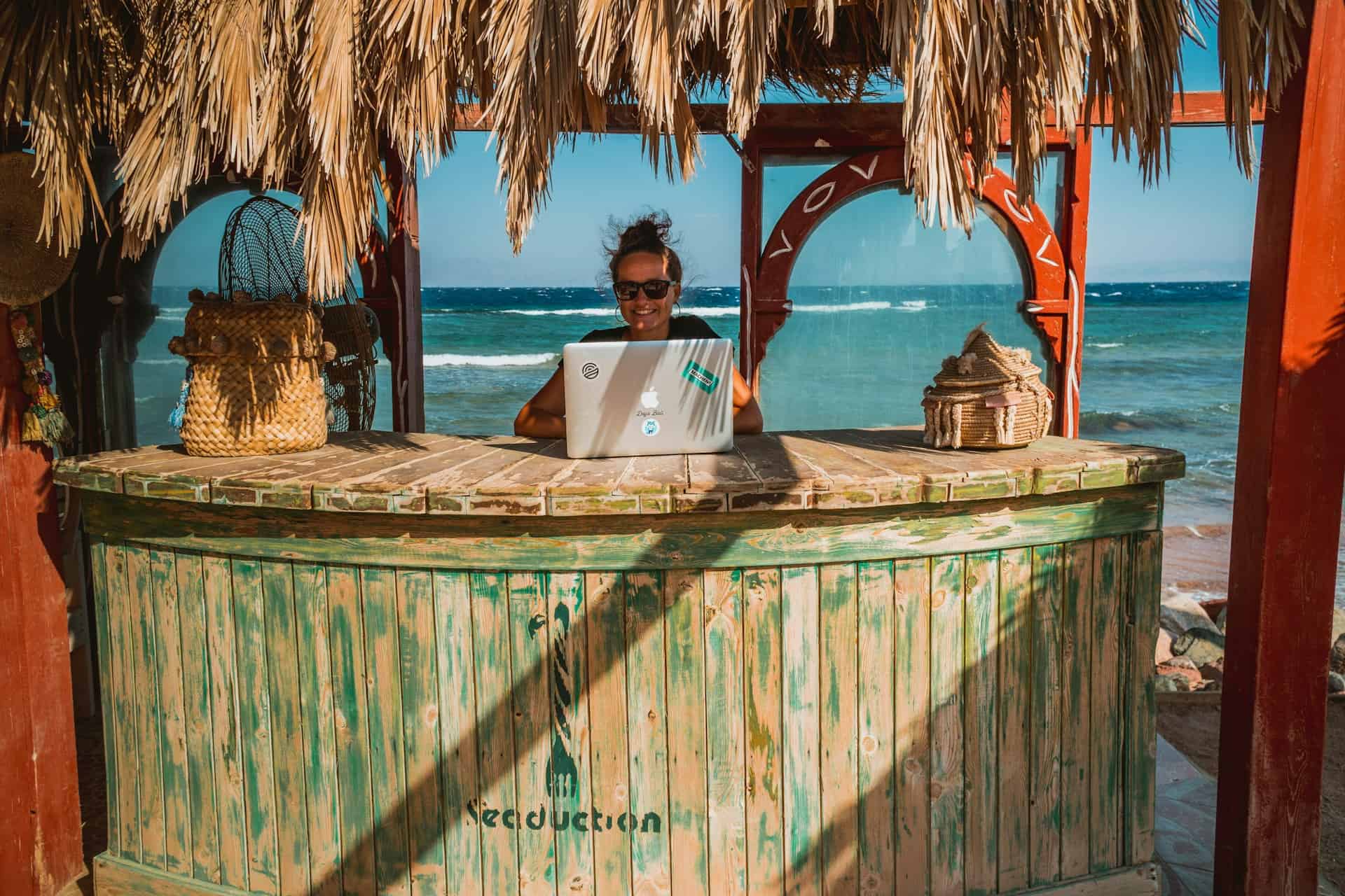 A digital nomad finds her work travel balance at the beach (photo by Peggy Anke).