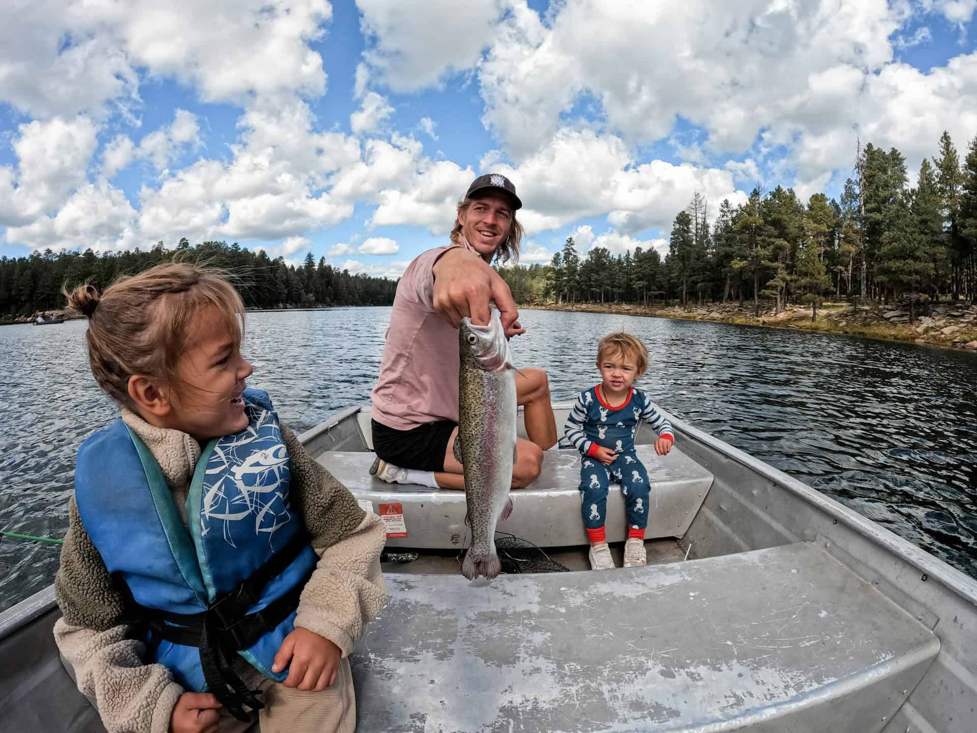A family fishing together (photo: Derek Owens, Unsplash).