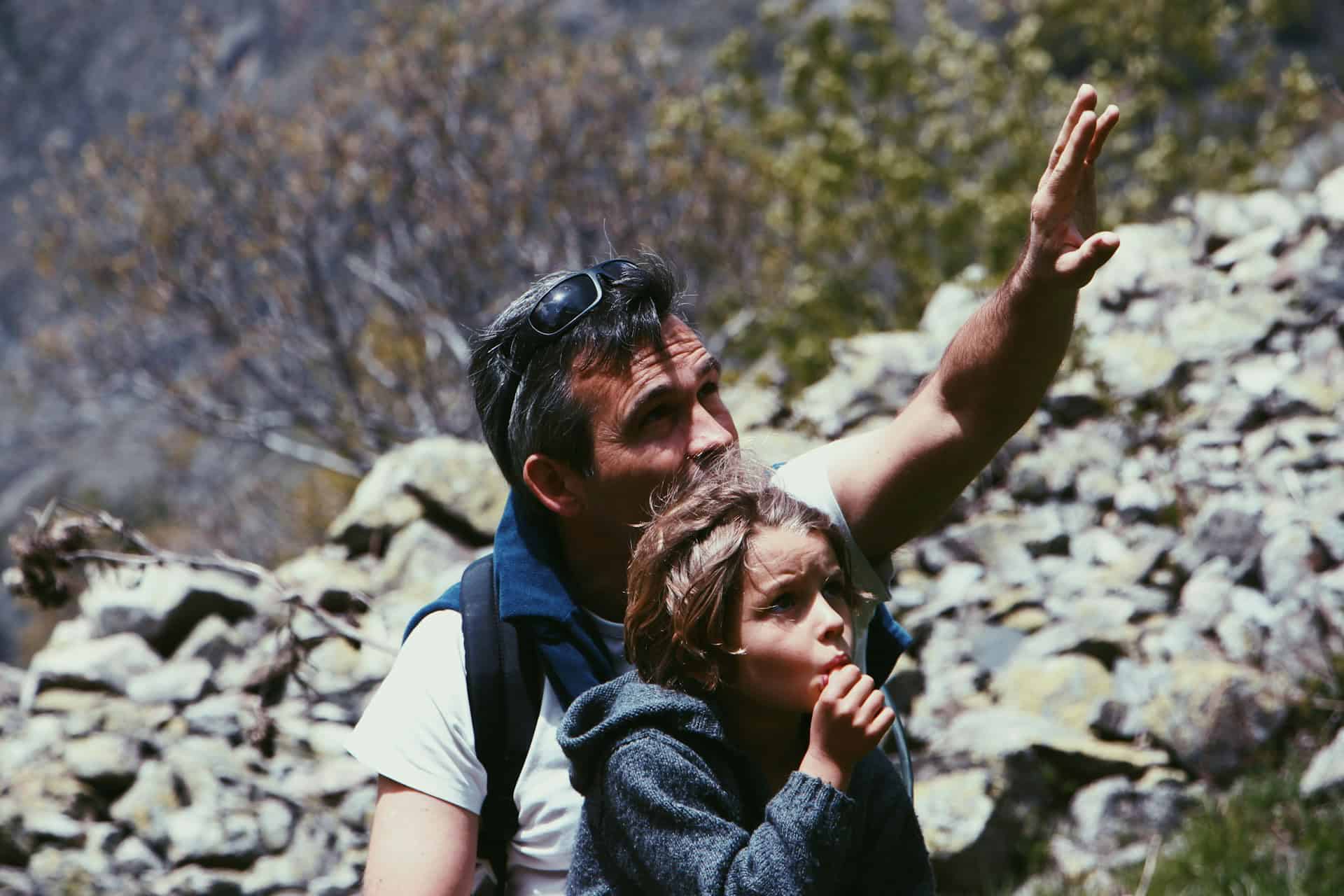 A father and child hiking in Champoléon, France (photo: Mael Balland, Unsplash).