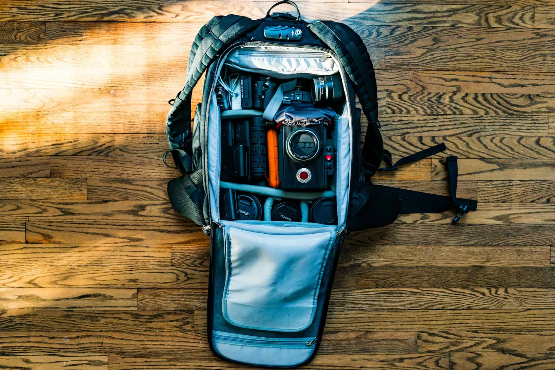 Camera bag with gear (photo: Skye Studios, Unsplash).