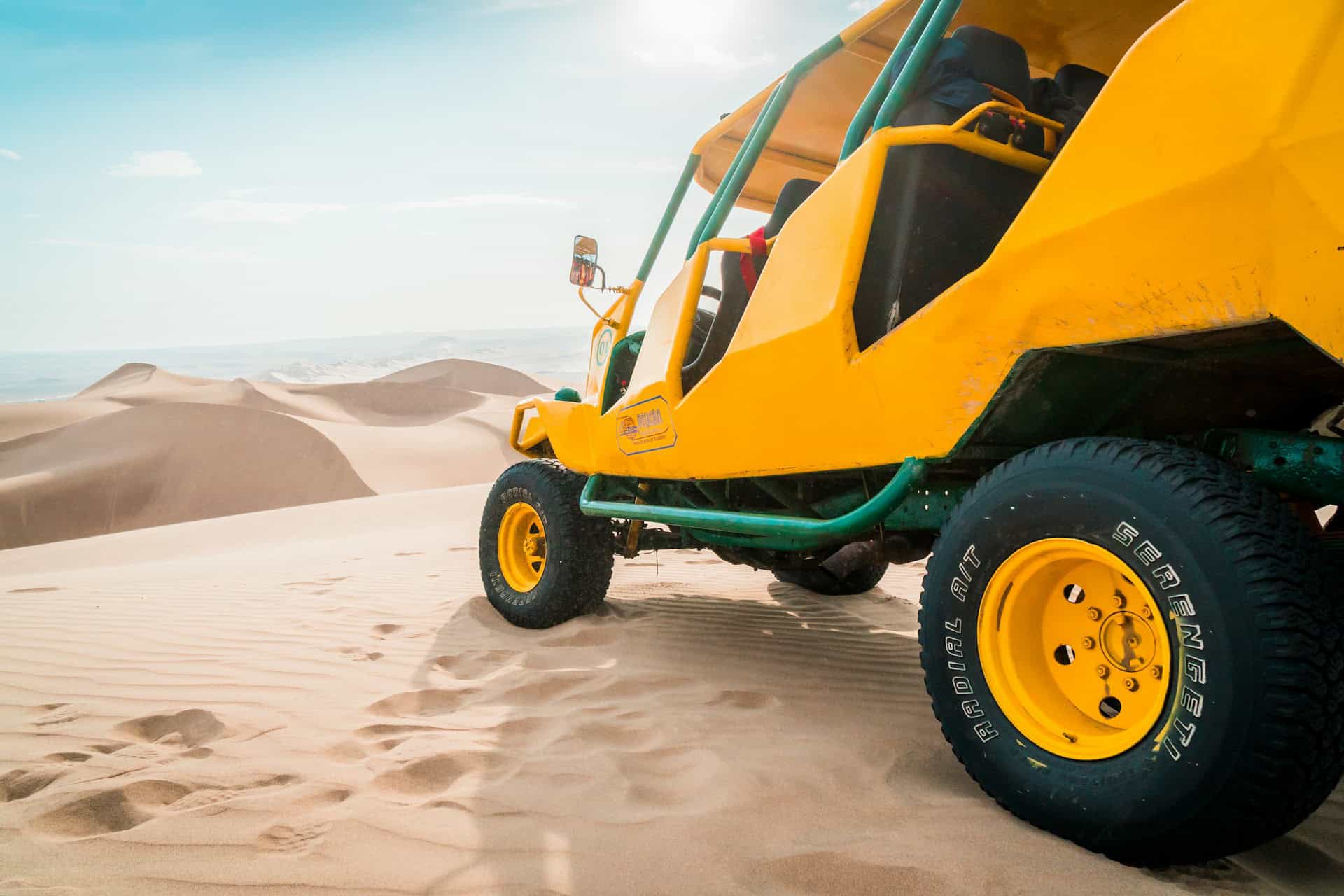 Yellow dune buggy Huacachina Peru (photo: Willian Justen de Vasconcellos, Unsplash).