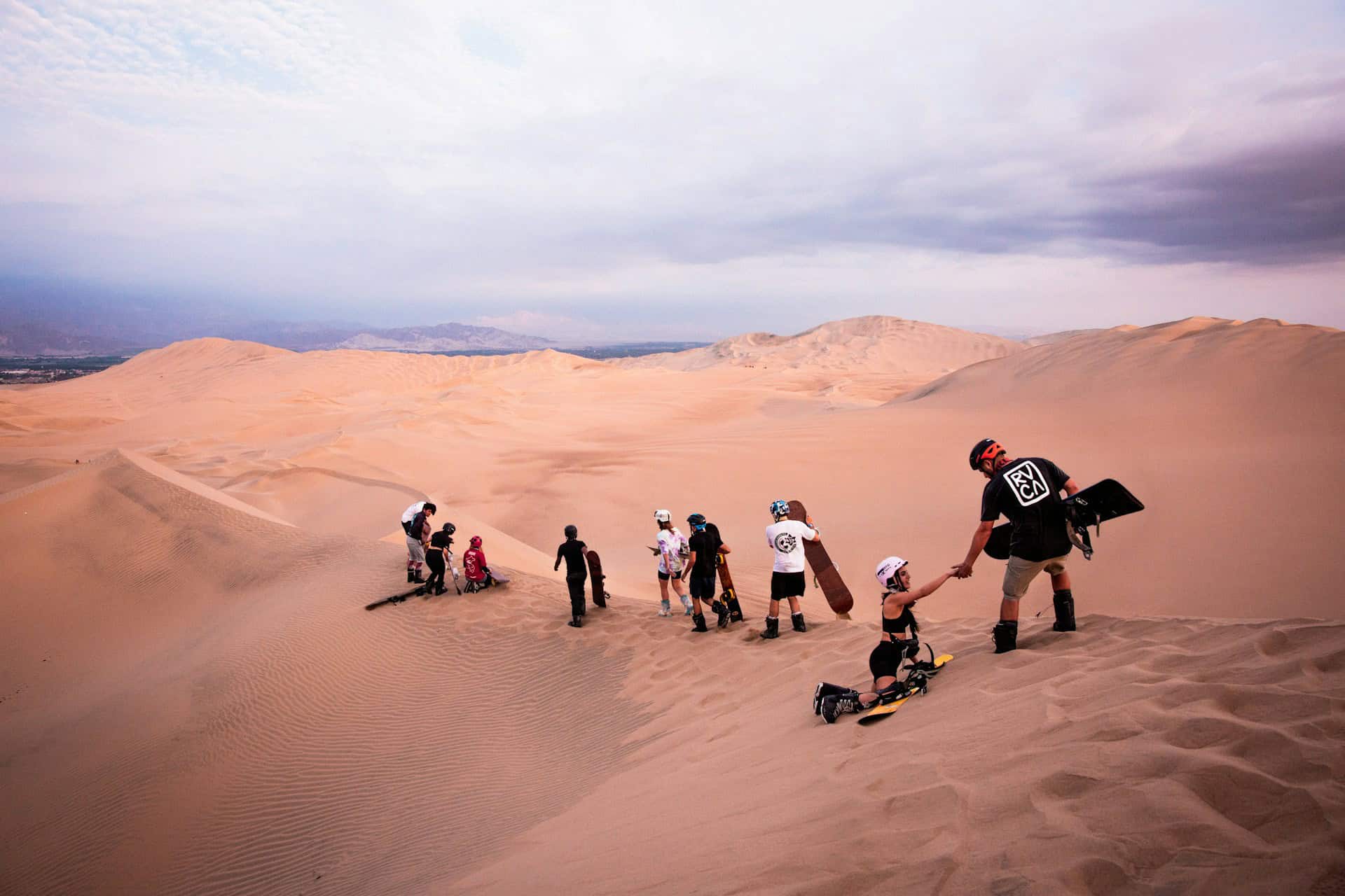 Sandboarding the dunes of Huacachina (photo: Alvaro Palacios, Unsplash).