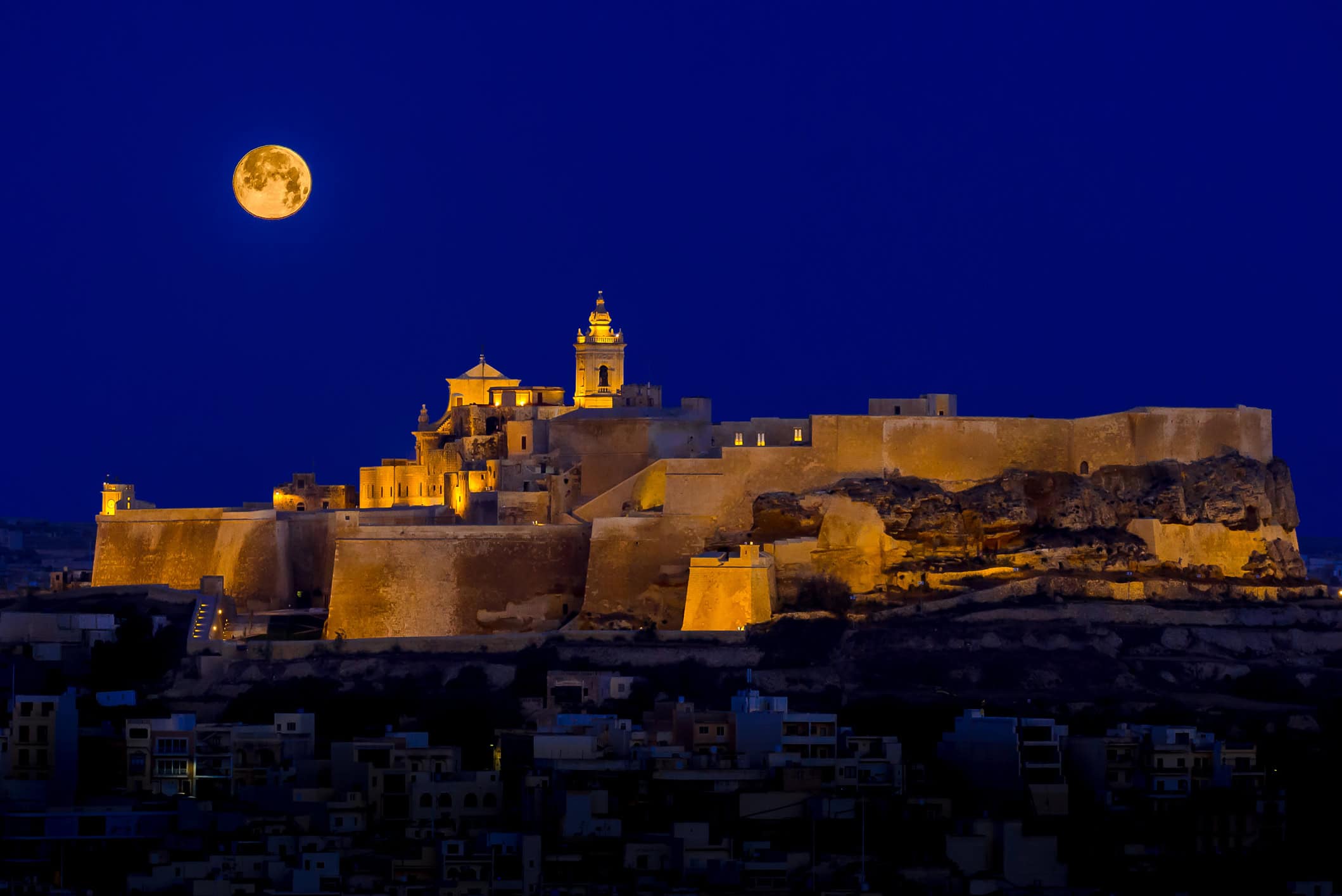 The Citadella illuminated at night in Victoria, Gozo