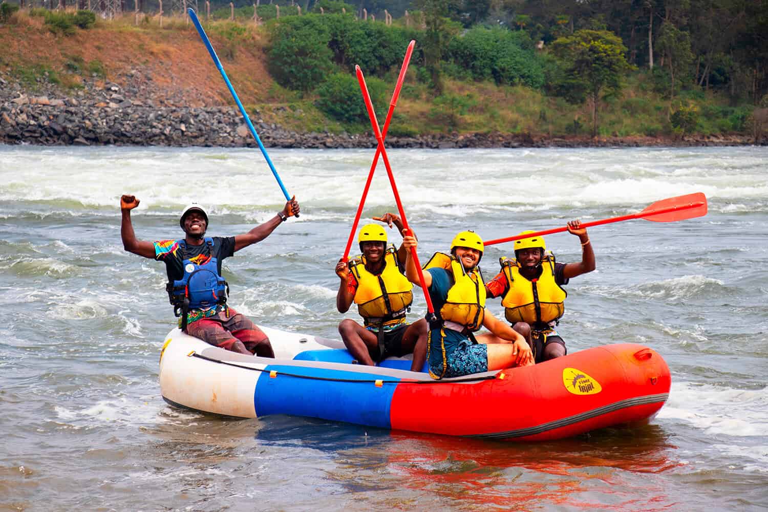 Group celebrating after rafting the Nile River in Uganda