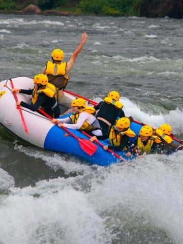 Raft crashing through Grade 5 rapids on the Nile River near Jinja, Uganda