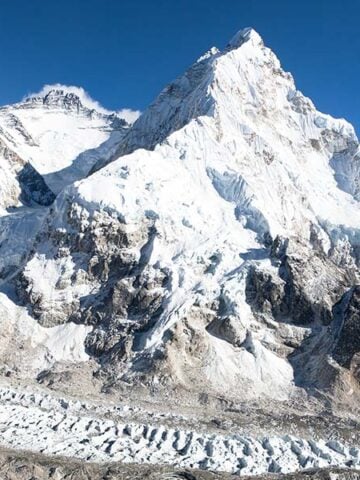 Way to Everest Base Camp sign overlooking Mount Everest in Nepal.