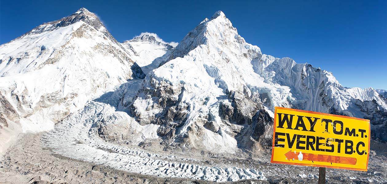 Way to Everest Base Camp sign overlooking Mount Everest in Nepal.