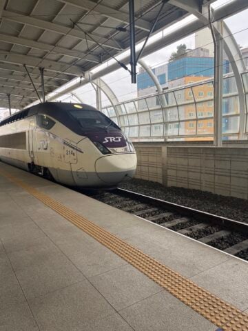 An SRT high-speed train (no. 214) is waiting at the platform