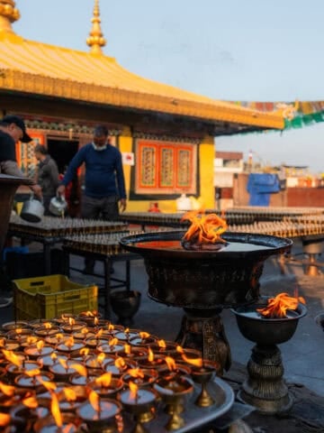 Yak butter lamps at Buddhist temple in Nepal.