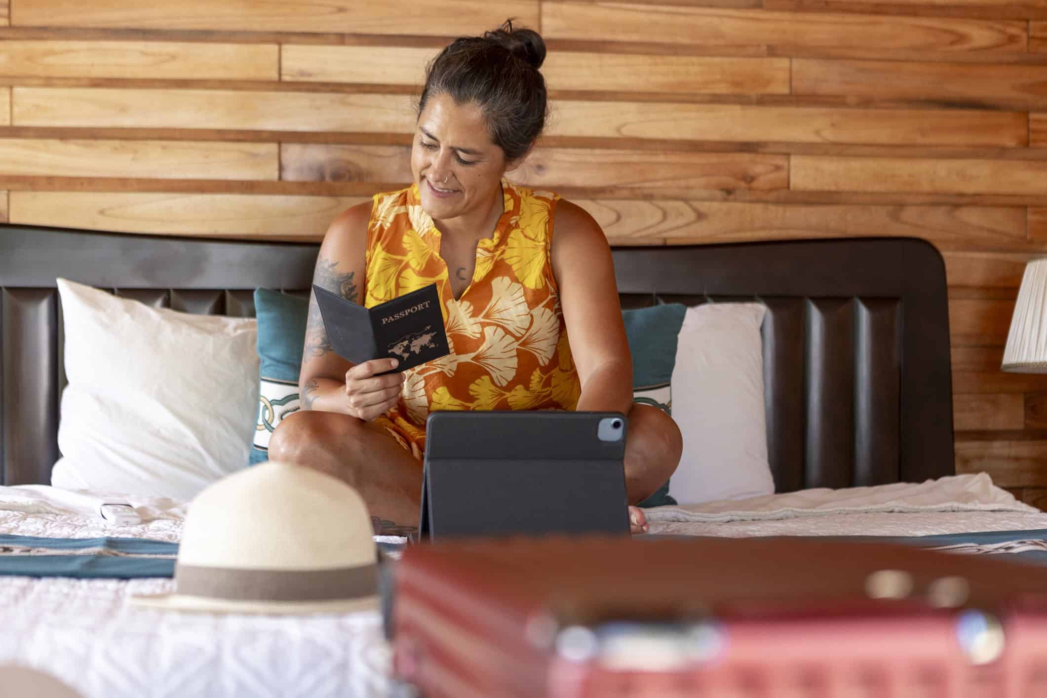 Traveler reviewing her passport while preparing for life abroad
